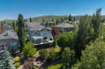 Experience luxury living in this stunning multi-level home, boasting a spacious backyard with a fire pit and mature trees for ultimate privacy.