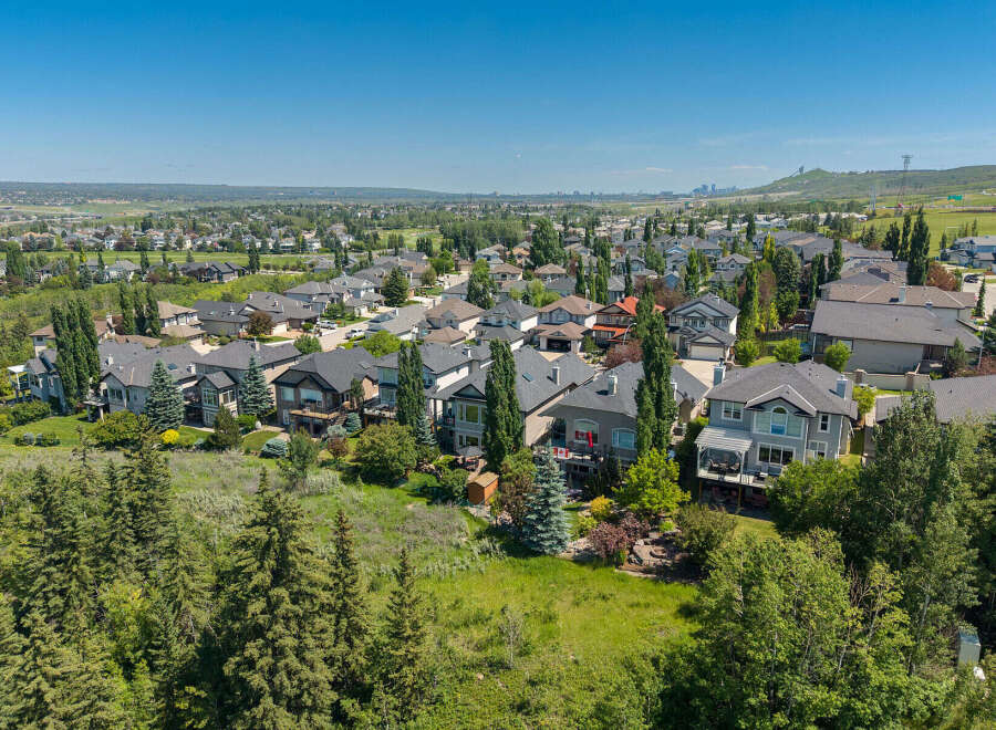 Discover this stunning aerial view of a suburban neighborhood, showcasing a collection of well-maintained homes with diverse architectural styles.