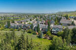 Discover this stunning aerial view of a suburban neighborhood, showcasing a collection of well-maintained homes with diverse architectural styles.