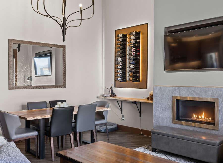 Experience modern living with this stunning dining and living area, featuring a sleek dining set perfect for intimate meals.