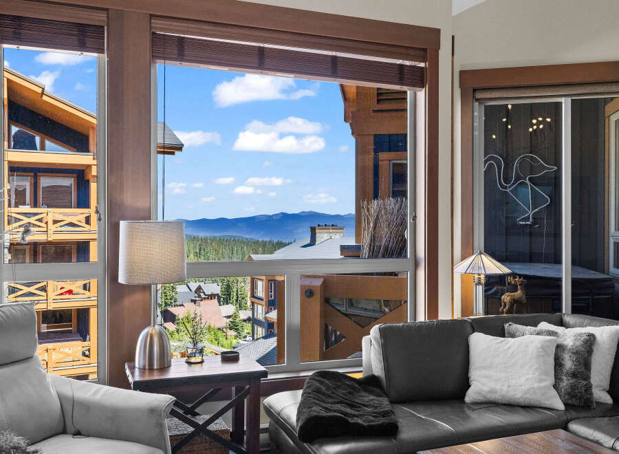 Experience breathtaking mountain views from this stunning property, featuring expansive windows that flood the living space with natural light.