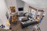 Experience luxury living in this stunning open-concept great room, featuring a soaring vaulted ceiling and a modern gas fireplace.