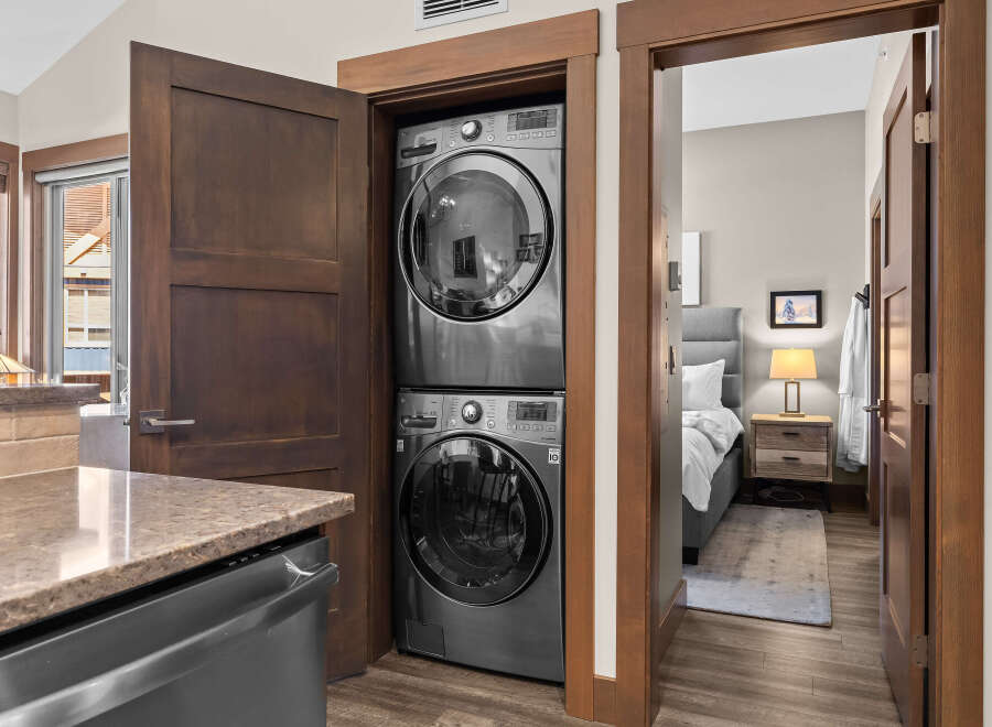 Discover modern convenience with this stacked LG washer and dryer set, perfect for maximizing space in your home.