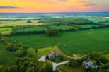 Experience serene country living with this stunning aerial view of a sprawling estate.