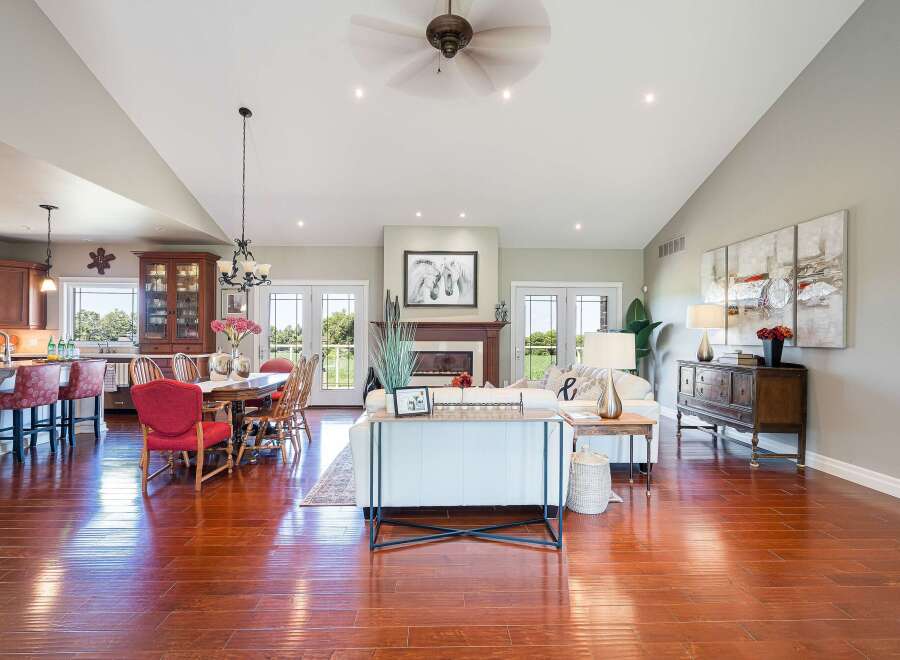 Experience luxurious open-concept living in this stunning home, featuring a gourmet kitchen with ample cabinetry and a spacious dining area perfect for entertaining.