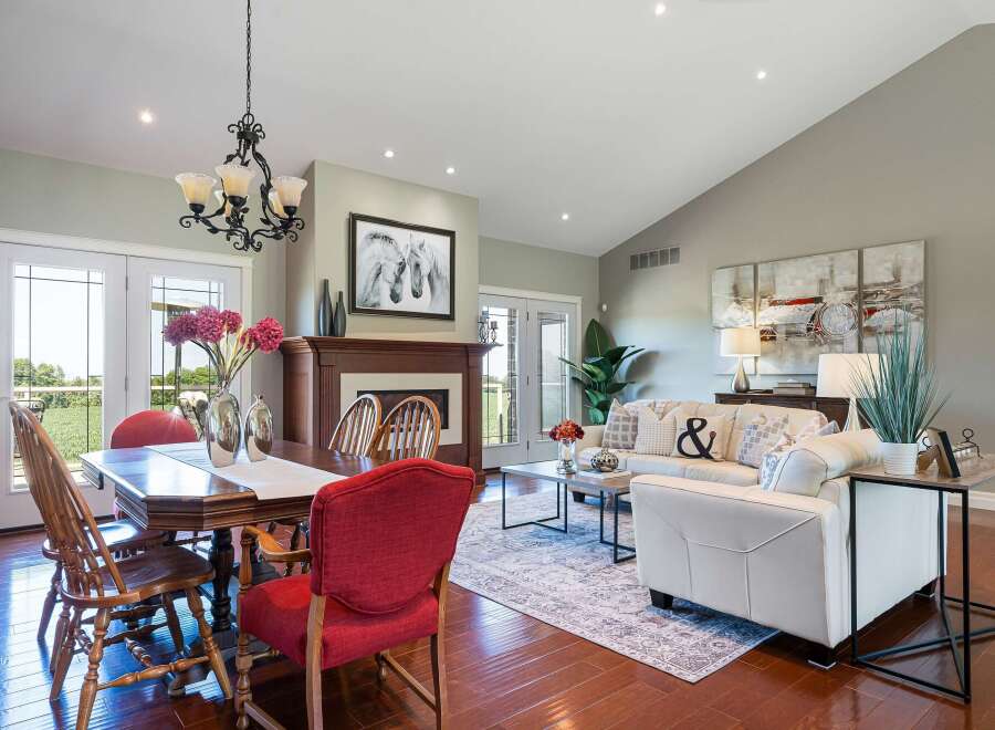 Experience elegant living in this spacious open-concept home, featuring a formal dining area perfect for gatherings and a cozy living room with a fireplace.