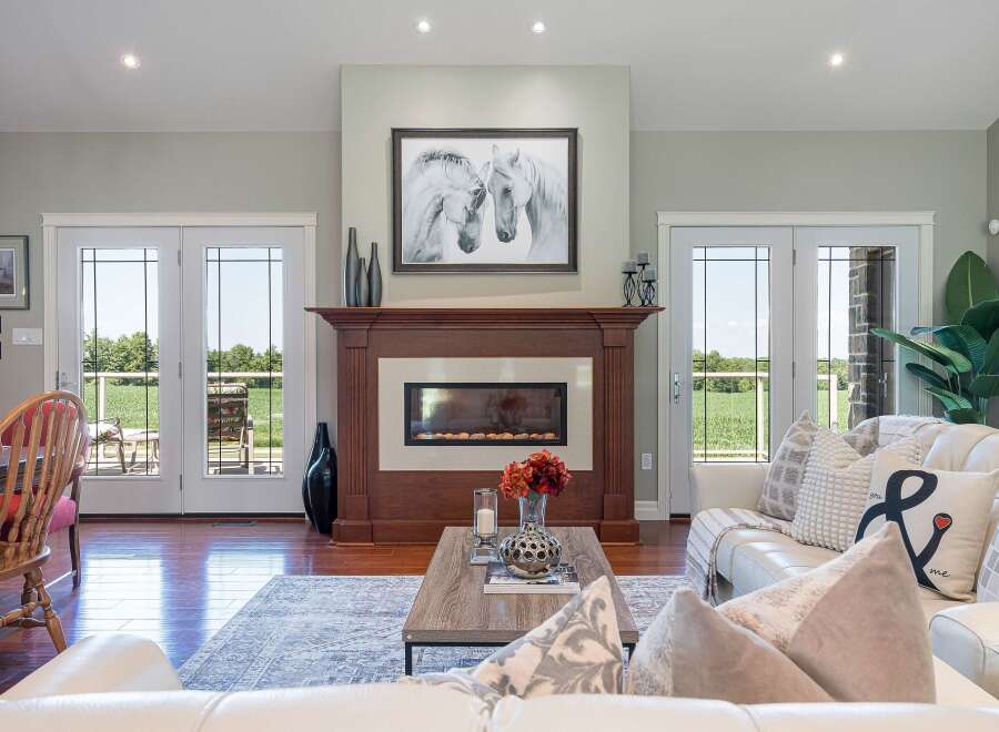 Experience luxury living in this stunning home featuring a modern fireplace as the centerpiece of the living room.