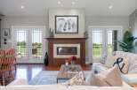 Experience luxury living in this stunning home featuring a modern fireplace as the centerpiece of the living room.