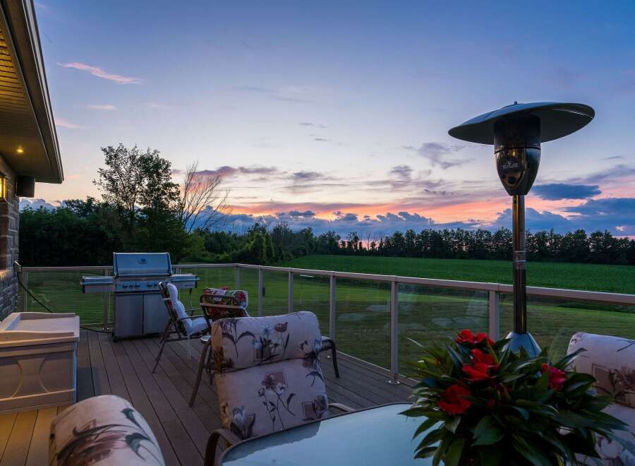 Enjoy breathtaking sunset views from this expansive deck, perfect for entertaining or relaxing.