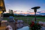 Enjoy breathtaking sunset views from this expansive deck, perfect for entertaining or relaxing.