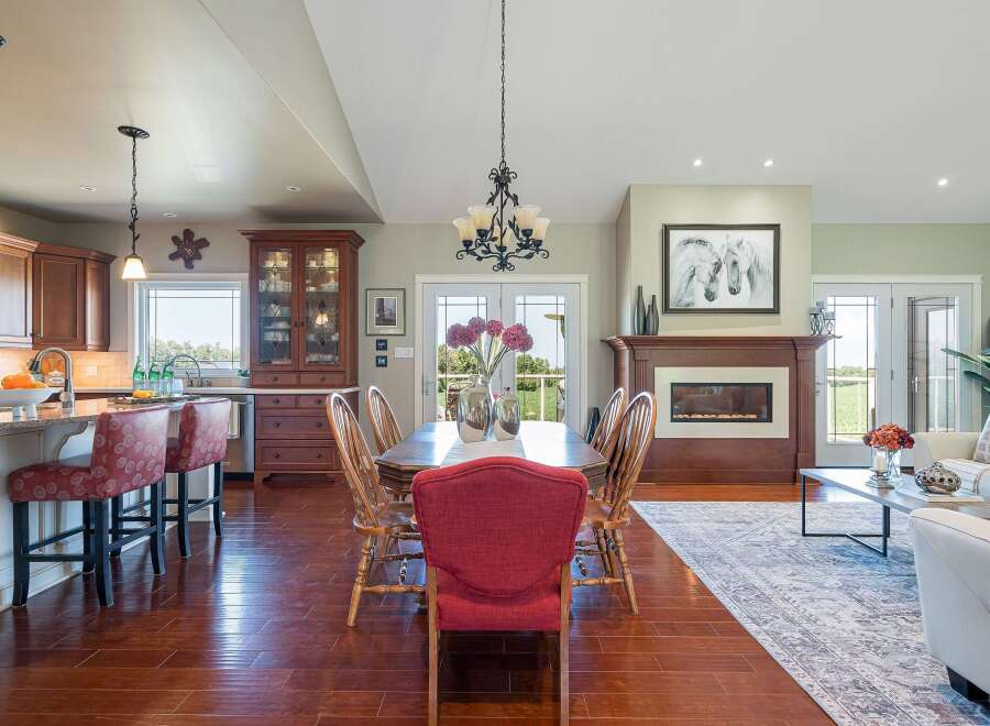 Experience open-concept living in this beautifully appointed home, featuring a gourmet kitchen with a breakfast bar and a spacious dining area perfect for entertaining.