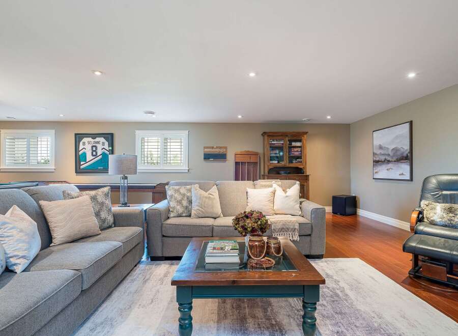 This inviting living space features a comfortable sectional sofa, perfect for relaxing or entertaining.