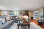 This inviting living space features a comfortable sectional sofa, perfect for relaxing or entertaining.