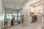 Step into this beautifully designed home, featuring a bright and airy staircase with modern pendant lighting.