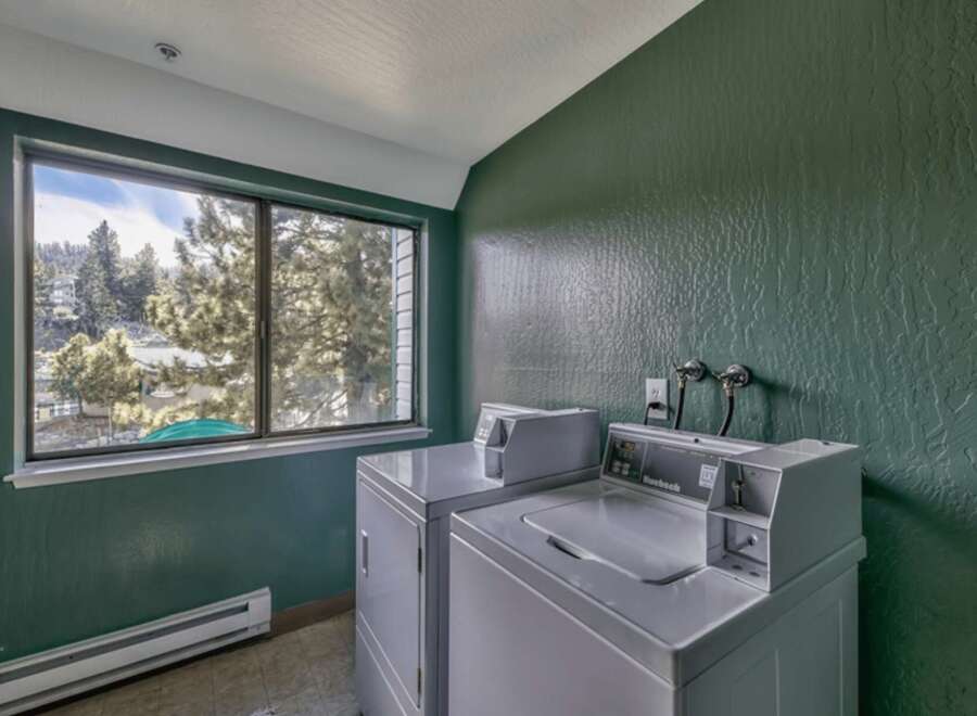 Enjoy the convenience of in-unit laundry with this spacious apartment, featuring two large washers and dryers.