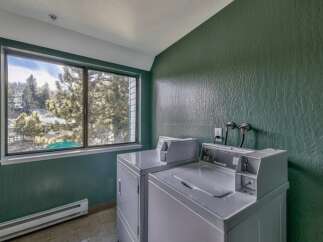 Enjoy the convenience of in-unit laundry with this spacious apartment, featuring two large washers and dryers.