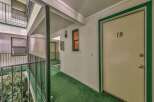 Discover this charming apartment complex with a welcoming outdoor walkway leading to unit 10.