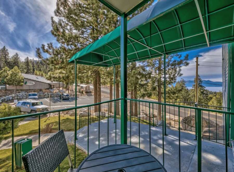 Enjoy breathtaking lake views from this charming balcony, perfect for morning coffee or evening relaxation.