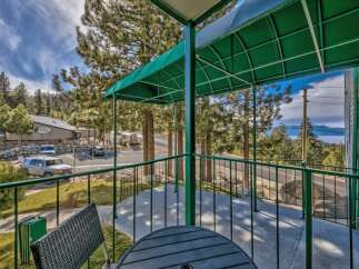 Enjoy breathtaking lake views from this charming balcony, perfect for morning coffee or evening relaxation.