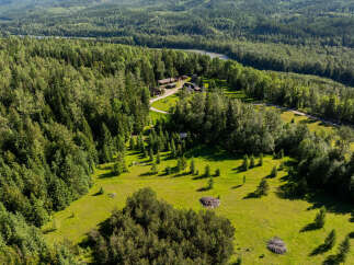 Discover this secluded property nestled amidst a lush, green forest, offering unparalleled privacy and tranquility.