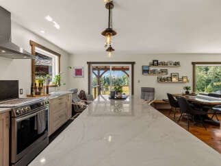 Experience the best of indoor-outdoor living in this stunning kitchen and dining area.