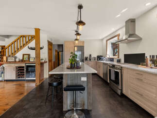 Experience the perfect blend of rustic charm and modern convenience in this stunning kitchen.