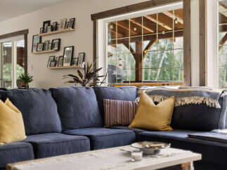 Experience cozy living in this inviting living room, featuring a spacious sectional sofa perfect for family gatherings.