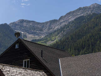 Nestled against a majestic mountain backdrop, this property offers a unique blend of rustic charm and natural beauty.