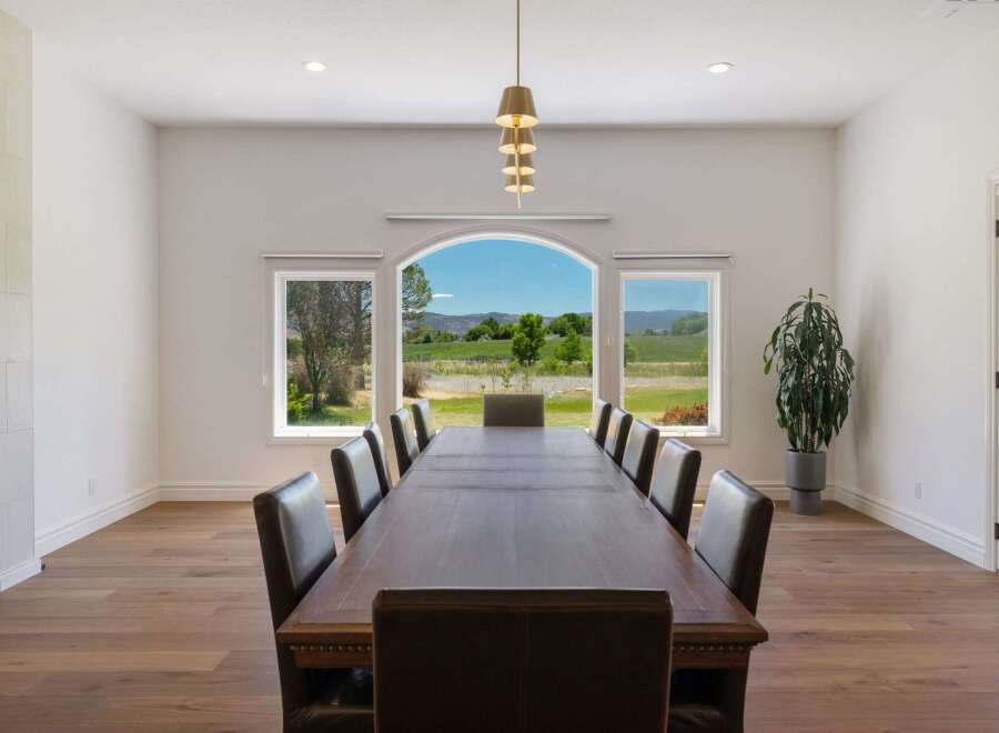 Experience elegant dining with this expansive table, perfect for hosting memorable gatherings.
