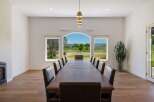 Experience elegant dining with this expansive table, perfect for hosting memorable gatherings.