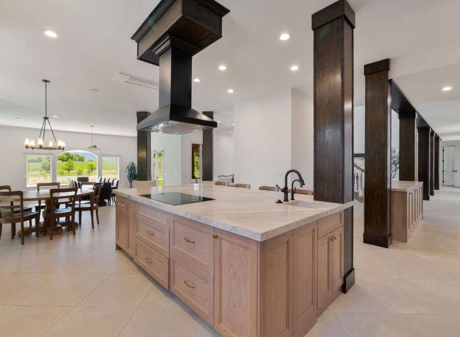 Experience luxury living in this expansive open-concept kitchen and dining area, perfect for entertaining.