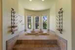 Indulge in relaxation in this luxurious bathroom featuring a spacious sunken jacuzzi tub.