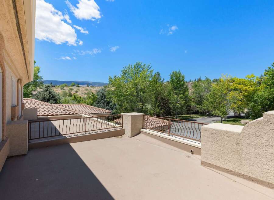Enjoy breathtaking views from this elevated balcony, perfect for morning coffee or evening relaxation.