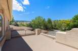 Enjoy breathtaking views from this elevated balcony, perfect for morning coffee or evening relaxation.