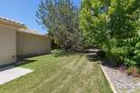 Enjoy the lush green backyard of this property, perfect for outdoor activities and relaxation.
