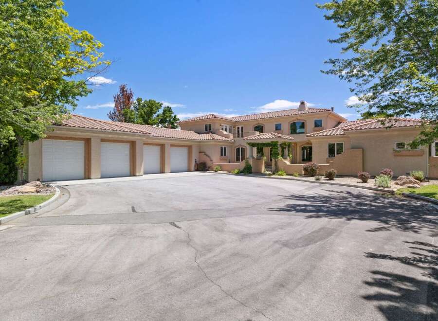 This stunning estate boasts a spacious multi-car garage, perfect for car enthusiasts or ample storage needs.