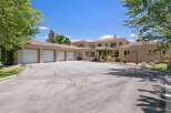 This stunning estate boasts a spacious multi-car garage, perfect for car enthusiasts or ample storage needs.