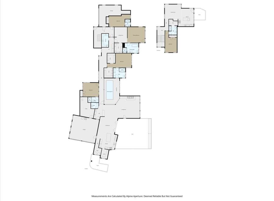 Discover this expansive property featuring multiple living spaces, including a formal dining area, a cozy sitting room, and a spacious family room perfect for gatherings.