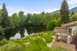 Experience serene living with this stunning property featuring a private pond and lush greenery, perfect for tranquil moments.
