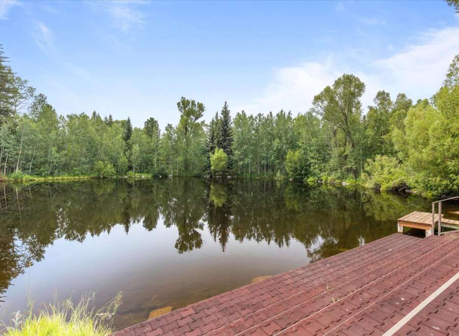 Enjoy serene waterfront living with this stunning property featuring a private lake perfect for recreation and relaxation.