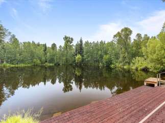 Enjoy serene waterfront living with this stunning property featuring a private lake perfect for recreation and relaxation.