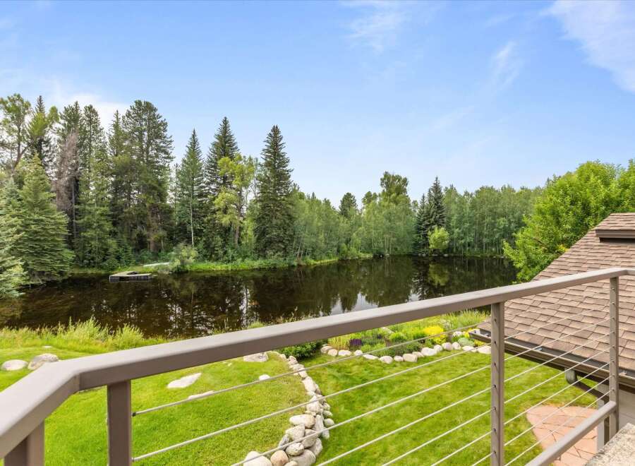 Enjoy serene lakefront living with this stunning property, offering breathtaking views of the water and surrounding lush greenery.