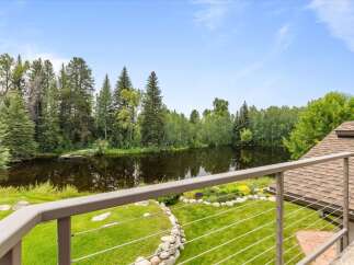 Enjoy serene lakefront living with this stunning property, offering breathtaking views of the water and surrounding lush greenery.