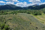 Discover breathtaking mountain views and serene natural beauty from this expansive property.