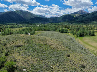 Discover breathtaking mountain views and serene natural beauty from this expansive property.