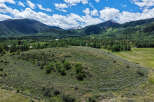 Discover breathtaking mountain views and serene natural beauty from this expansive property.
