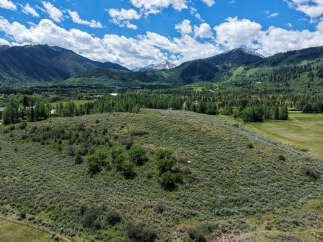 Discover breathtaking mountain views and serene natural beauty from this expansive property.