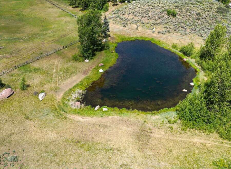 Discover this stunning property featuring a serene pond, perfect for tranquil moments and outdoor enjoyment.