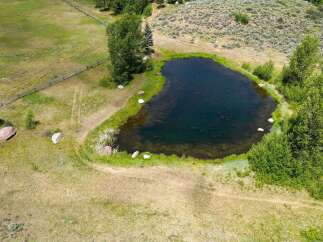 Discover this stunning property featuring a serene pond, perfect for tranquil moments and outdoor enjoyment.