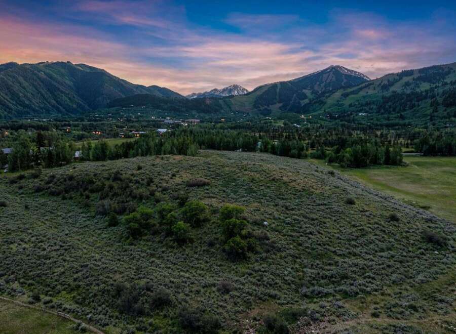 Experience breathtaking mountain views from this expansive property, perfect for building your dream home.